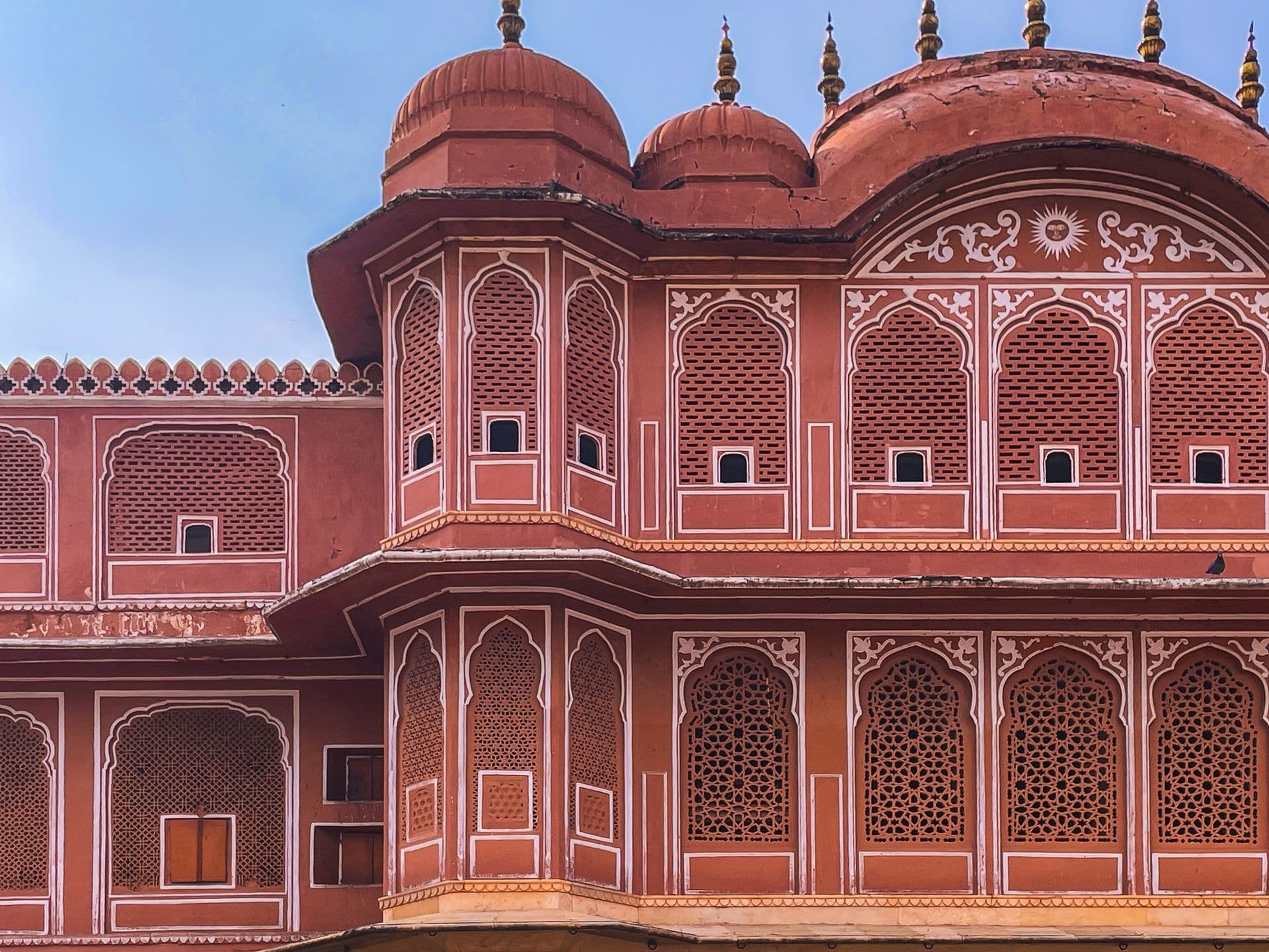 Iconic Hawa Mahal facade in Jaipur with pink sandstone architecture